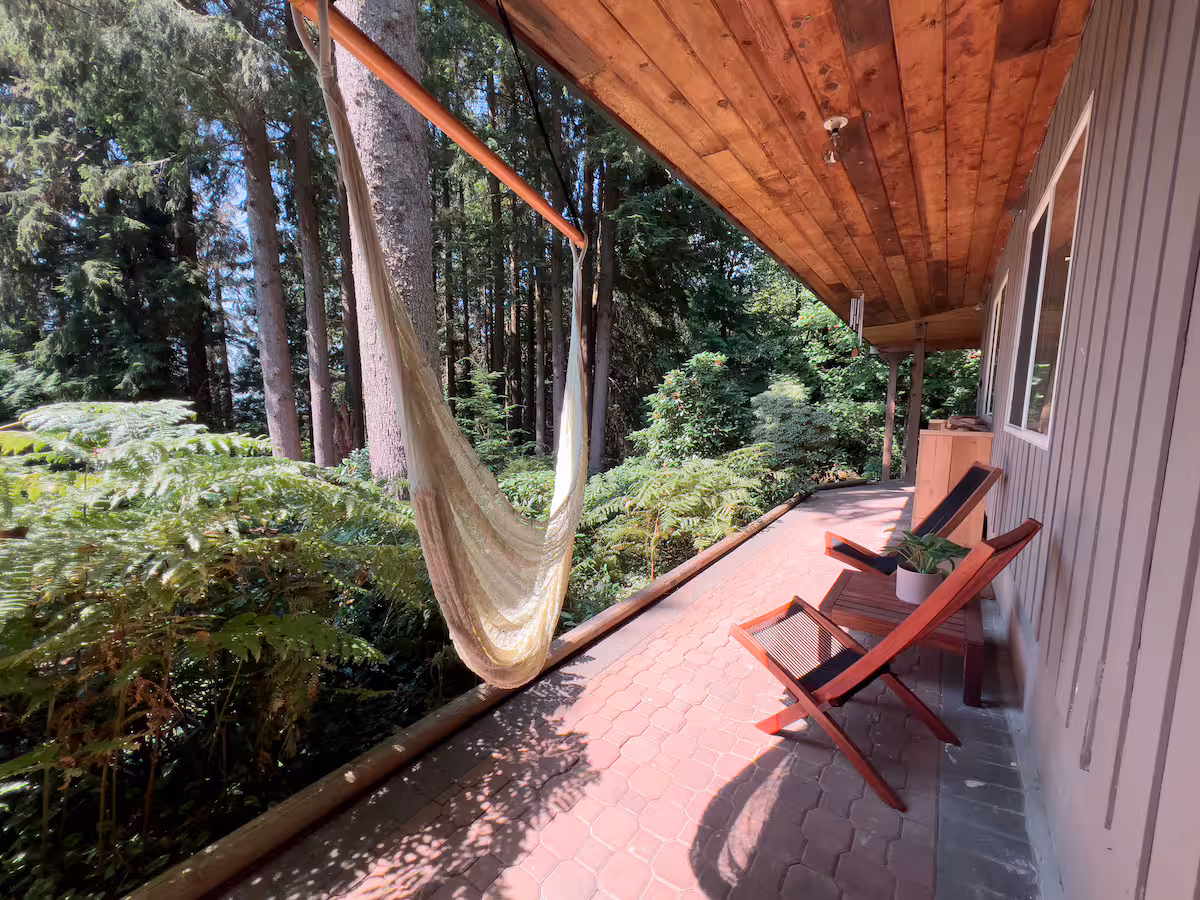 Covered patio surrounded by Douglas fir