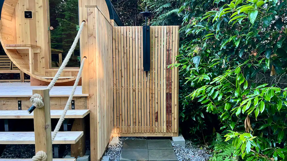The cedar outdoor shower next to the sauna